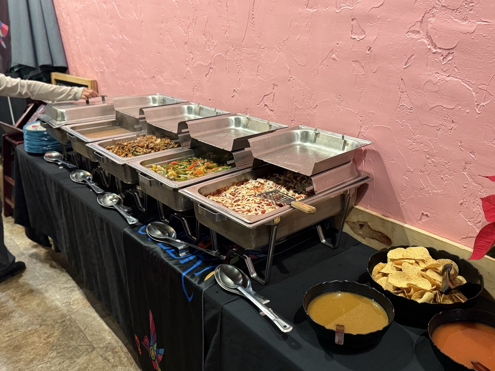 Guests serving themselves at the catering buffet