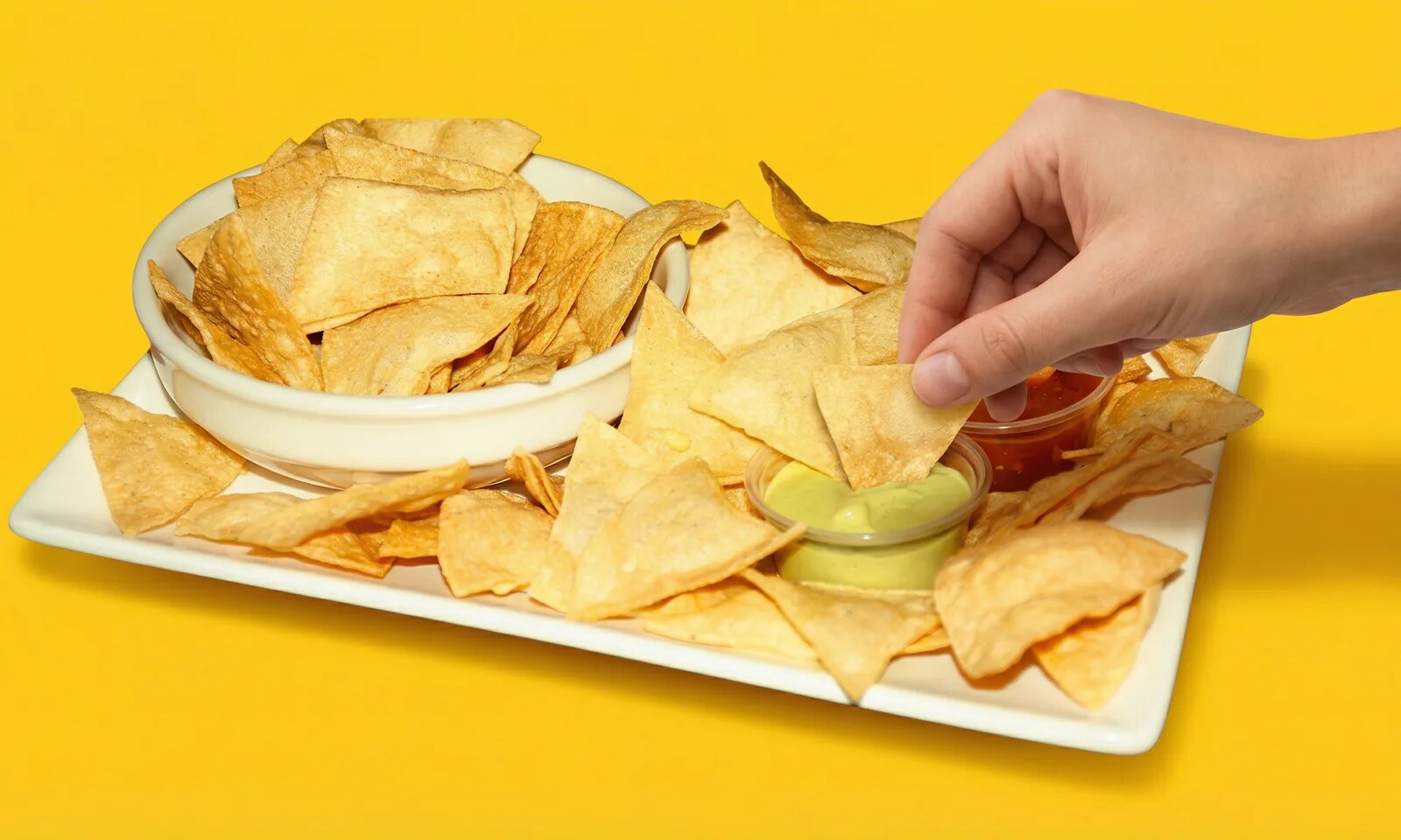 Loaded chicken nachos with avocado and jalapeños